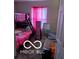 bedroom with bunk beds and pink bedding at 2714 Baltimore Ave, Indianapolis, IN 46218
