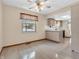 Dining area with tile floor, ceiling fan and kitchen access at 313 Crosby Dr, Indianapolis, IN 46227