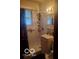 Clean bathroom with shower/tub combo and vanity at 3915 Brookville Rd, Indianapolis, IN 46201