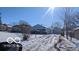 Cute bungalow on a snowy lot with a detached garage at 3915 Brookville Rd, Indianapolis, IN 46201