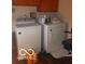 Bright laundry room with washer, dryer, and extra space at 3915 Brookville Rd, Indianapolis, IN 46201