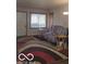 Living room with comfy couch and large patterned rug at 3915 Brookville Rd, Indianapolis, IN 46201
