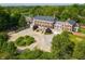 Extensive aerial view of the beautiful property with lush landscaping, pond, and driveway at 4601 N Legacy Dr, Muncie, IN 47304