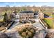 Impressive brick manor house with circular driveway and manicured landscaping at 4601 N Legacy Dr, Muncie, IN 47304