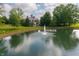 Aerial view showcasing a fountain in the pond on this serene property at 4601 N Legacy Dr, Muncie, IN 47304