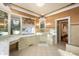 Elegant bathroom featuring a vanity with decorative lighting, tile floors, and luxurious details at 4601 N Legacy Dr, Muncie, IN 47304