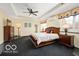 Spacious bedroom with a king-size bed and ceiling fan at 4601 N Legacy Dr, Muncie, IN 47304