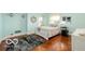 Charming bedroom with hardwood floors and a queen bed at 4601 N Legacy Dr, Muncie, IN 47304