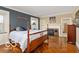 Cozy bedroom with hardwood floors and fireplace at 4601 N Legacy Dr, Muncie, IN 47304