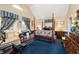 Spacious bedroom featuring a four-poster bed, sitting area, and vaulted ceilings at 4601 N Legacy Dr, Muncie, IN 47304