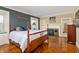 Comfortable bedroom with hardwood floors, a decorative fireplace, and natural light at 4601 N Legacy Dr, Muncie, IN 47304