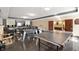 Spacious game room featuring a foosball table, ping pong table, and entertainment area at 4601 N Legacy Dr, Muncie, IN 47304