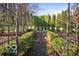 Landscaped garden with arbor and pathway, showcasing serene outdoor space at 4601 N Legacy Dr, Muncie, IN 47304