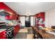 Modern kitchen with red cabinetry and granite countertops at 4601 N Legacy Dr, Muncie, IN 47304
