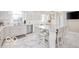 White kitchen features granite island and stainless steel appliances at 4601 N Legacy Dr, Muncie, IN 47304
