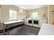 Bright laundry room with updated appliances, folding tables, and abundant natural light at 4601 N Legacy Dr, Muncie, IN 47304