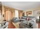 Spacious living room with comfortable sectional sofa and large windows at 4601 N Legacy Dr, Muncie, IN 47304