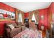 Cozy living room with a comfortable sofa, patterned rug, and vintage decor at 4601 N Legacy Dr, Muncie, IN 47304