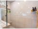 Modern tiled shower with glass enclosure and built-in shelving at 4601 N Legacy Dr, Muncie, IN 47304