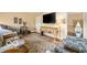 Relaxing sitting room with comfortable seating and a large TV at 4601 N Legacy Dr, Muncie, IN 47304