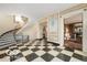 Impressive curved staircase with black railings in a grand foyer at 4601 N Legacy Dr, Muncie, IN 47304