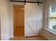 Stylish white barn door leading to an adjacent room, adding a rustic and modern touch at 4621 E 37Th St, Indianapolis, IN 46218