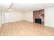 Finished basement featuring hardwood floors and a brick fireplace at 4621 E 37Th St, Indianapolis, IN 46218