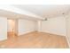 Finished basement area with hardwood floors and access to other rooms at 4621 E 37Th St, Indianapolis, IN 46218