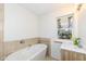Modern bathroom with soaking tub and updated vanity at 4621 E 37Th St, Indianapolis, IN 46218