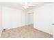 Spacious bedroom with ceiling fan and mirrored closet doors at 4621 E 37Th St, Indianapolis, IN 46218