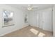 Bright bedroom with ceiling fan and two windows at 4621 E 37Th St, Indianapolis, IN 46218