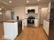 Well-lit kitchen featuring a center island, wood countertops, and modern stainless steel appliances at 4621 E 37Th St, Indianapolis, IN 46218