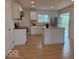 Modern kitchen with a center island, stainless steel appliances, and plenty of natural light at 4621 E 37Th St, Indianapolis, IN 46218