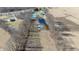 Aerial view featuring a pond and outbuildings near a residential area at 5682 N Michigan Rd, Fairland, IN 46126
