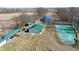 Expansive rural property featuring a large outbuilding and pond, tractors, and lush green land at 5682 N Michigan Rd, Fairland, IN 46126