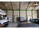 View of a metal barn, showing the roomy interior and ceiling beams at 5682 N Michigan Rd, Fairland, IN 46126