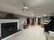 Spacious basement with a fireplace, tile flooring, and potential for various uses at 5682 N Michigan Rd, Fairland, IN 46126