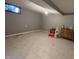 Clean basement featuring tile flooring, offering potential for storage or customization at 5682 N Michigan Rd, Fairland, IN 46126