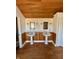 Bathroom with a wooden ceiling, double sinks and matching mirrors at 5682 N Michigan Rd, Fairland, IN 46126