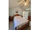 Cozy bedroom featuring soft lighting, carpeted floor, and traditional furnishings at 5682 N Michigan Rd, Fairland, IN 46126