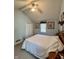Bedroom with vaulted ceiling and ceiling fan with framed art and comfortable bed at 5682 N Michigan Rd, Fairland, IN 46126