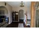 Charming entryway featuring natural light, hardwood floors, and a lovely staircase at 5682 N Michigan Rd, Fairland, IN 46126