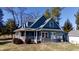 A beautiful home with a covered porch offering a perfect spot for relaxation and enjoyment at 5682 N Michigan Rd, Fairland, IN 46126