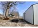 Exterior view of the home and shed surrounded by ample parking and equipment space at 5682 N Michigan Rd, Fairland, IN 46126