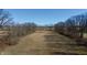Expansive field surrounded by bare trees under a clear blue sky at 5682 N Michigan Rd, Fairland, IN 46126