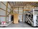 This garage features an RV and ample storage and workspace at 5682 N Michigan Rd, Fairland, IN 46126