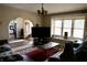 Bright open-concept living room with hardwood flooring and large windows at 5682 N Michigan Rd, Fairland, IN 46126