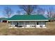 Large metal outbuilding with covered patio, offering ample space for storage and activities at 5682 N Michigan Rd, Fairland, IN 46126
