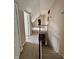 Staircase with beige walls and carpets leads to the upper and lower floors of the house at 5682 N Michigan Rd, Fairland, IN 46126