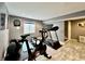 Basement home gym with treadmill and stationary bike at 5876 Sunnyvale Dr, Bargersville, IN 46106